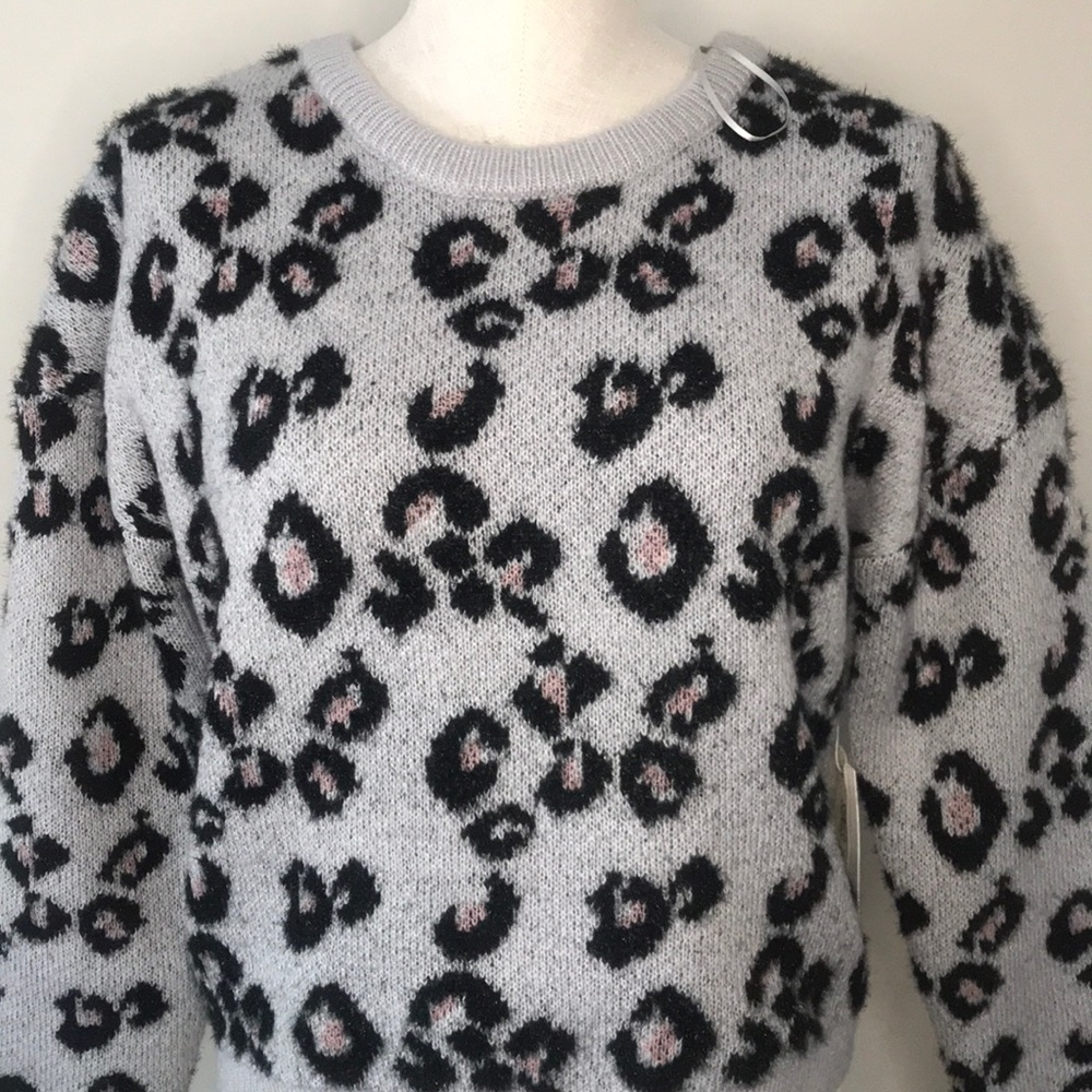 Leopard print fuzzy, pink, black, grey.